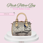 A plush pillow-style handbag with a light beige floral pattern, gold-tone handles and hardware, and a cartoon cat illustration on the front. The bag is displayed on a white pedestal against a pale pink background with decorative text reading 'Plush Pillow Bag' and 'Style 011'.