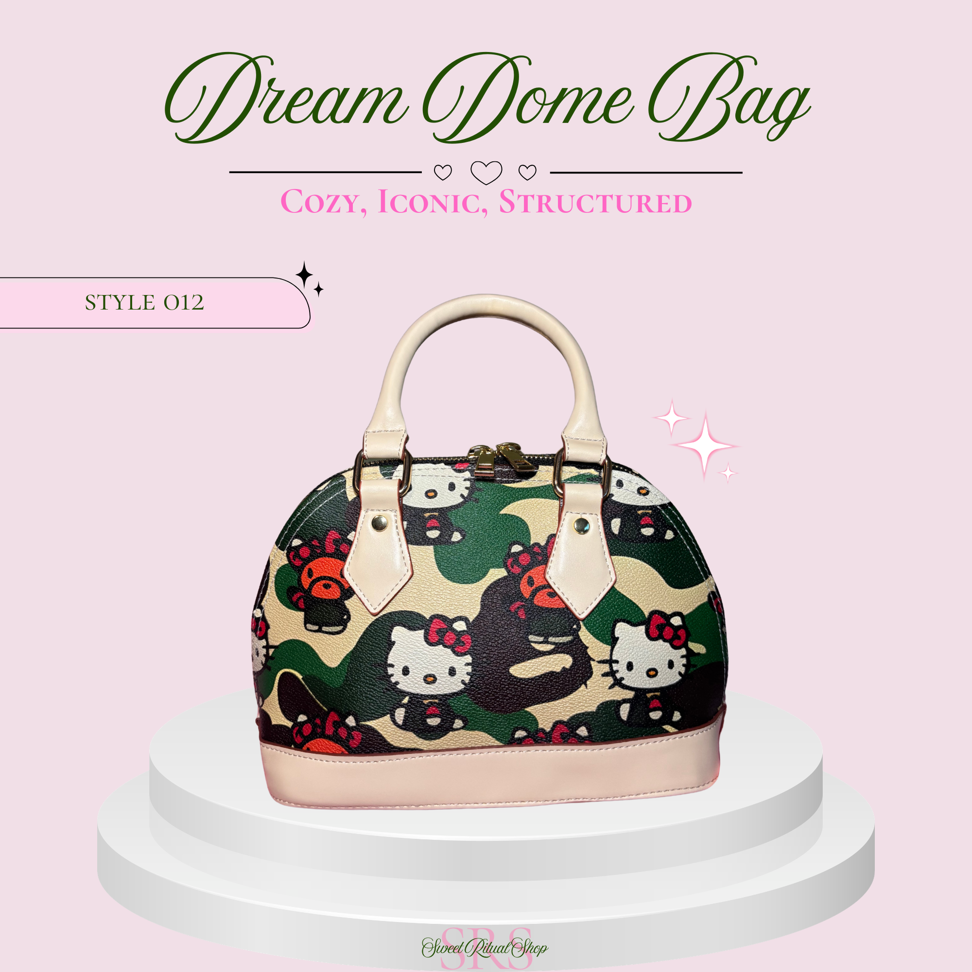 A structured dome handbag with a green camouflage pattern featuring Hello Kitty illustrations, cream-colored handles and trim, and a pink base. The bag is displayed on a white tiered pedestal against a light pink background with promotional text.