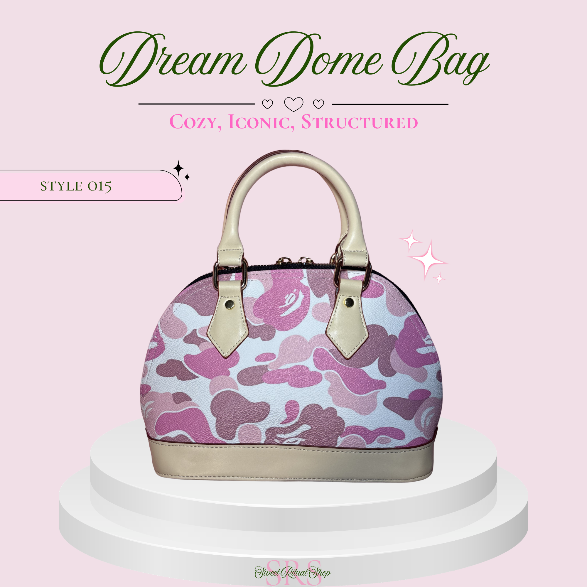 A structured dome handbag with a pink and purple camouflage pattern on a light background, featuring cream-colored handles and trim, displayed on a white pedestal against a light pink background with promotional text.