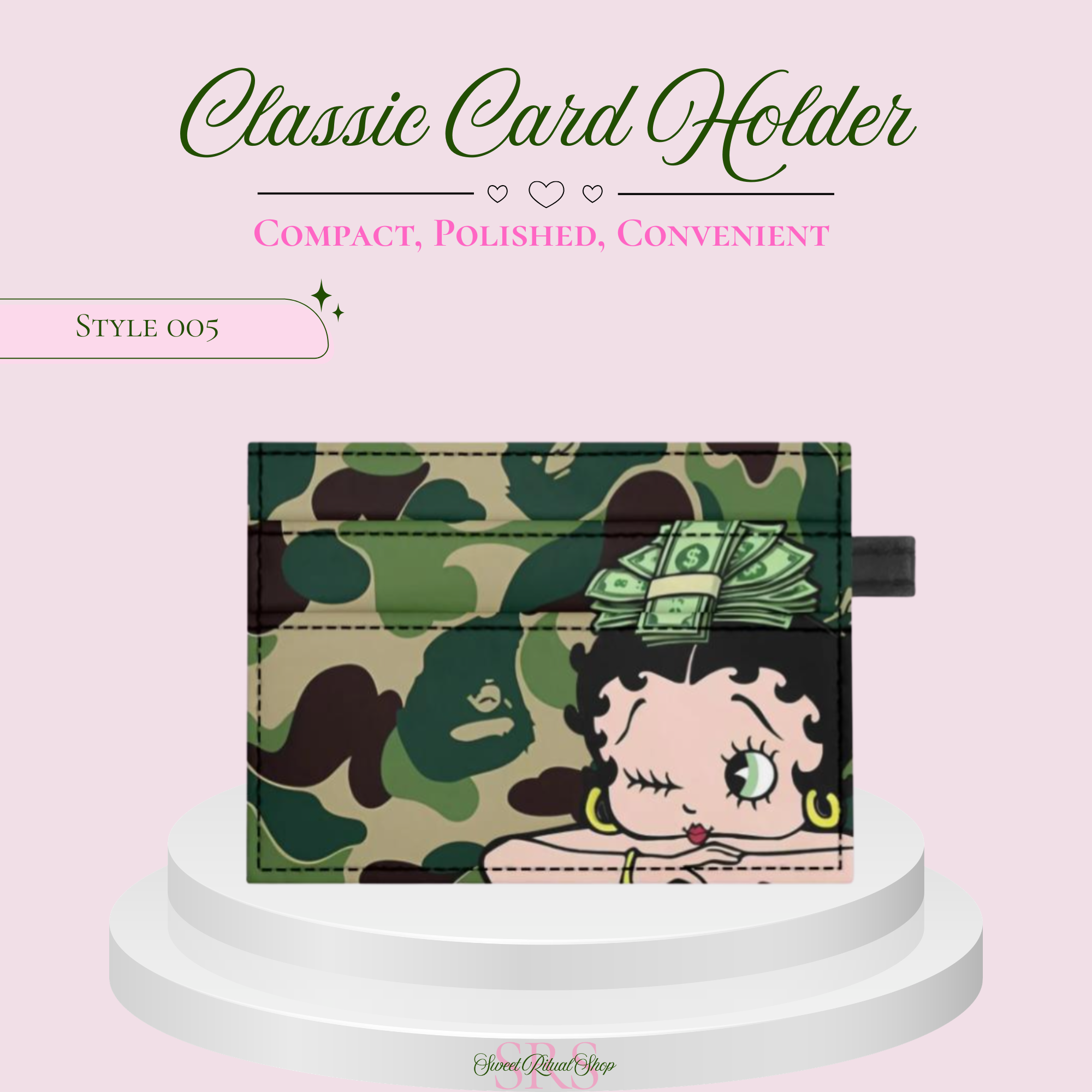 A compact card holder wallet featuring a green camouflage pattern and a cartoon Betty Rubble style illustration, displayed on a white pedestal against a light pink background with promotional text.
