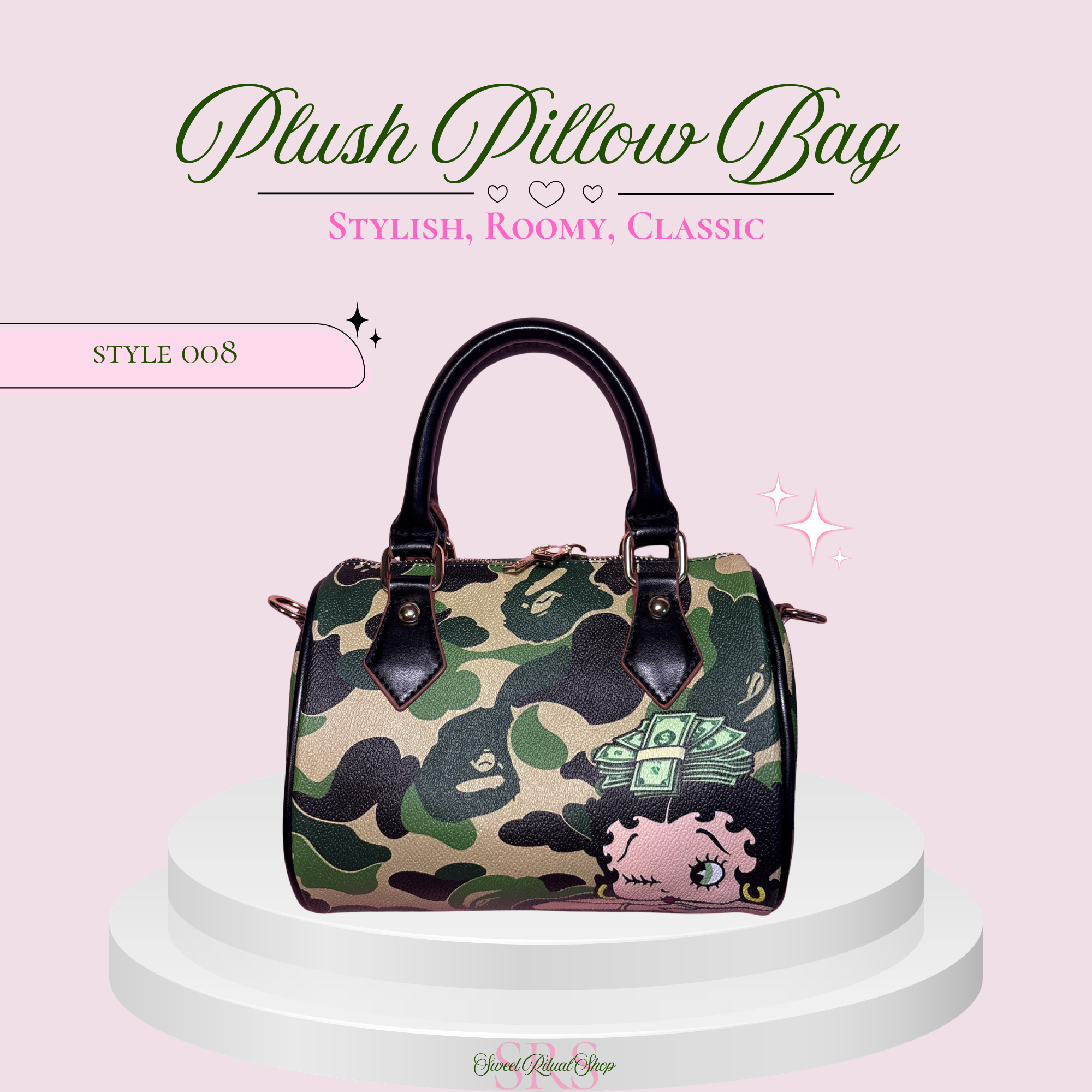 A plush pillow-style handbag with a green and black camouflage pattern, a pink cartoon pig graphic, and dark brown handles, displayed on a white pedestal against a light pink background with decorative text.